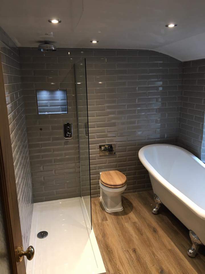 Finished bathroom refit with walk-in shower and roll-top bath
