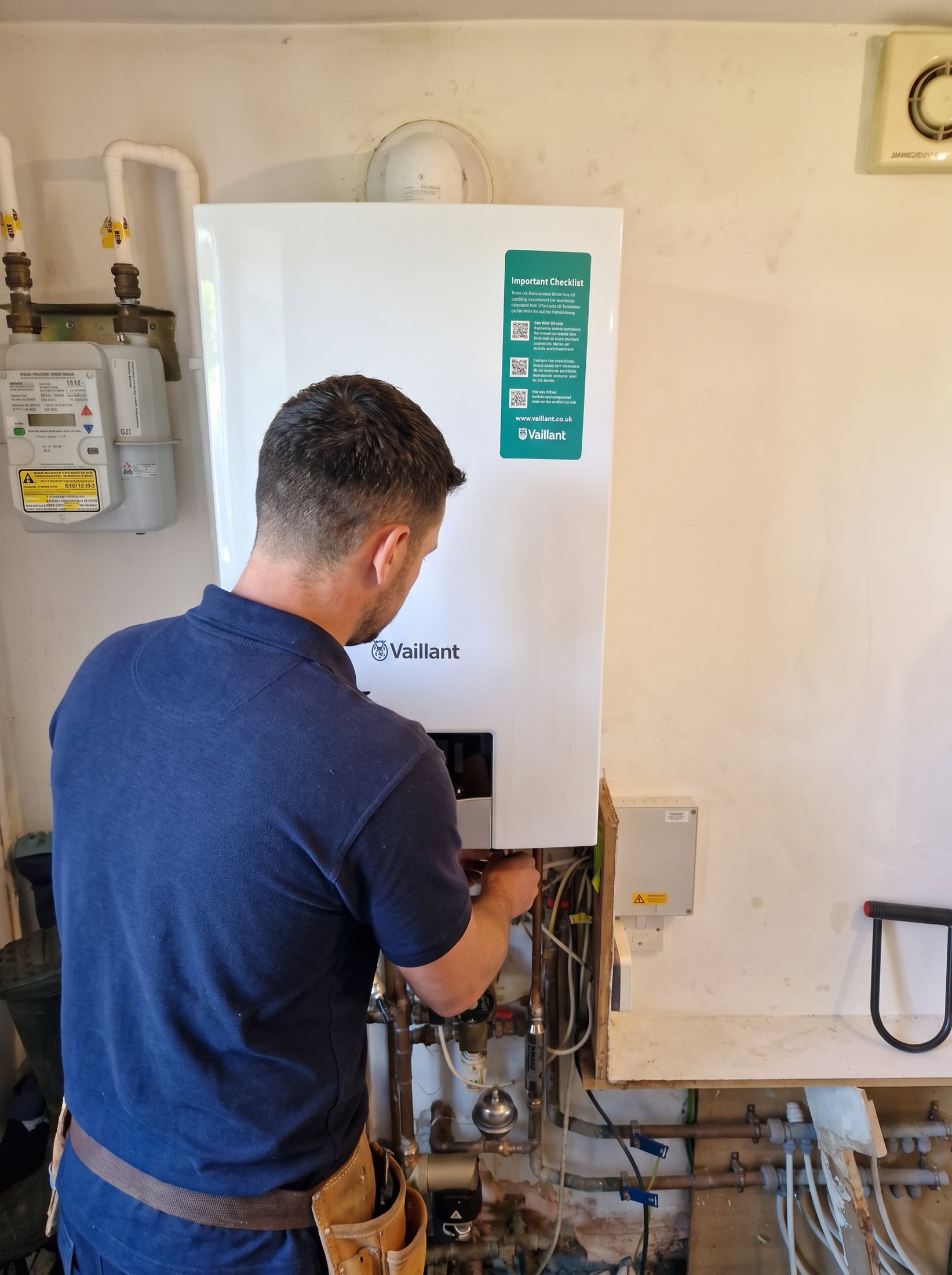 Heating engineer working on a Vaillant boiler installation in Kingston upon Thames